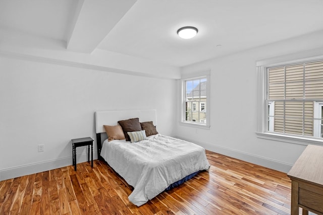 bedroom with hardwood / wood-style floors