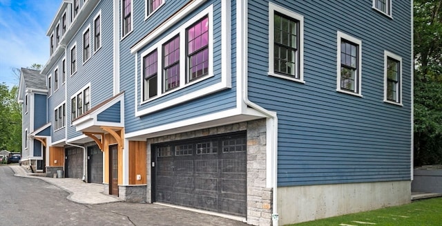 view of property exterior with a garage