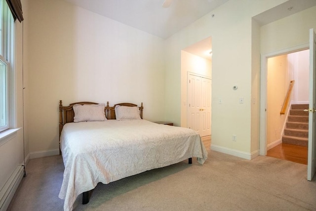 116 Spring Mdw Unit 116, Hanover, MA 02339 - bedroom with a baseboard radiator, carpet floors, baseboards, a closet, and a ceiling fan