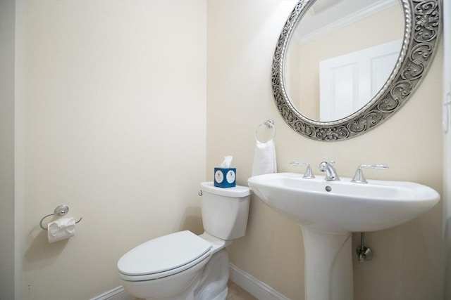 116 Spring Mdw Unit 116, Hanover, MA 02339 - half bathroom with toilet, baseboards, ornamental molding, and a sink