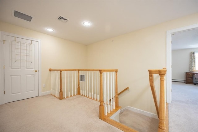 116 Spring Mdw Unit 116, Hanover, MA 02339 - corridor featuring an upstairs landing, carpet flooring, baseboard heating, baseboards, and recessed lighting