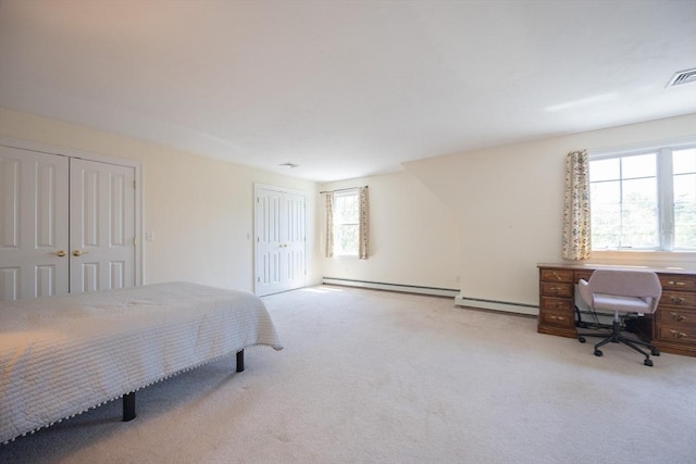 116 Spring Mdw Unit 116, Hanover, MA 02339 - bedroom featuring a baseboard heating unit, carpet floors, and multiple closets