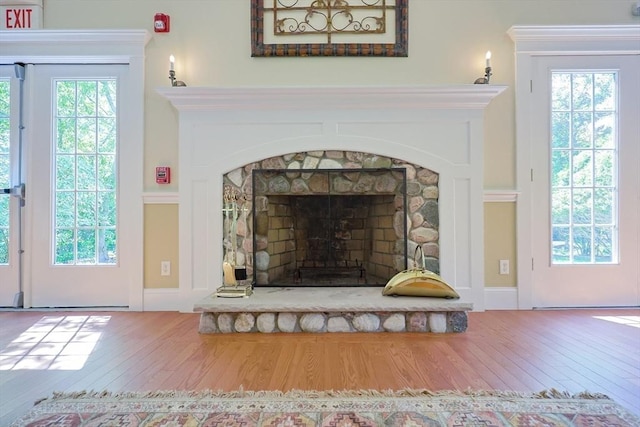 116 Spring Mdw Unit 116, Hanover, MA 02339 - detailed view of wood finished floors, a fireplace, and a fire alarm