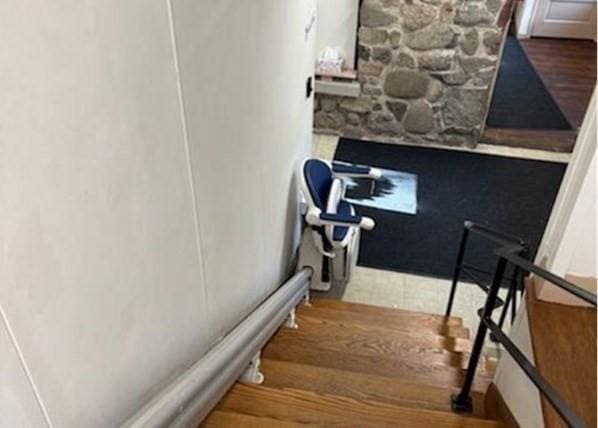 stairway with wood finished floors