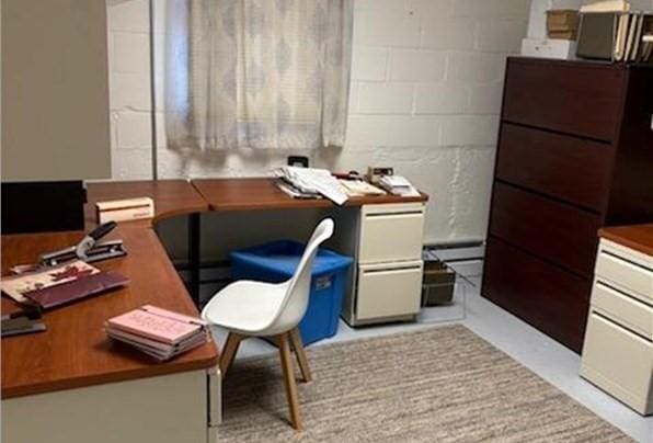 office space featuring concrete block wall