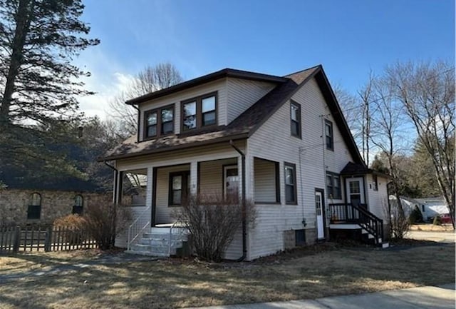 view of front facade with fence and a porch