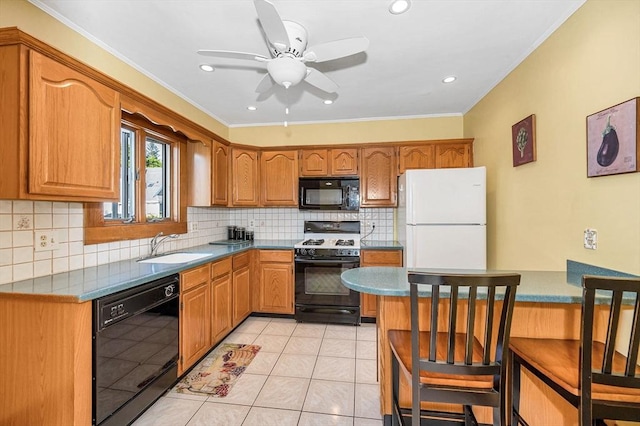 kitchen with black appliances, a sink, ornamental molding, decorative backsplash, and ceiling fan