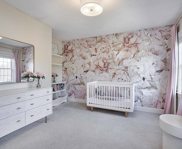 bedroom featuring baseboards, light colored carpet, and wallpapered walls