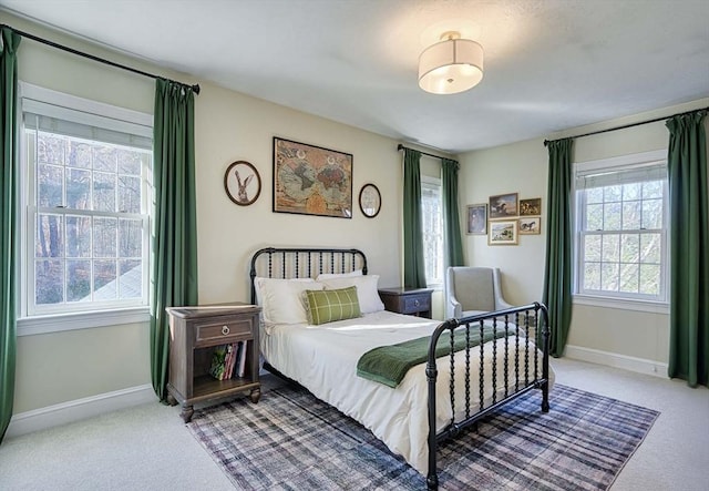 carpeted bedroom with baseboards