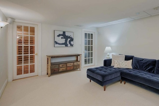 living room featuring carpet floors and baseboards