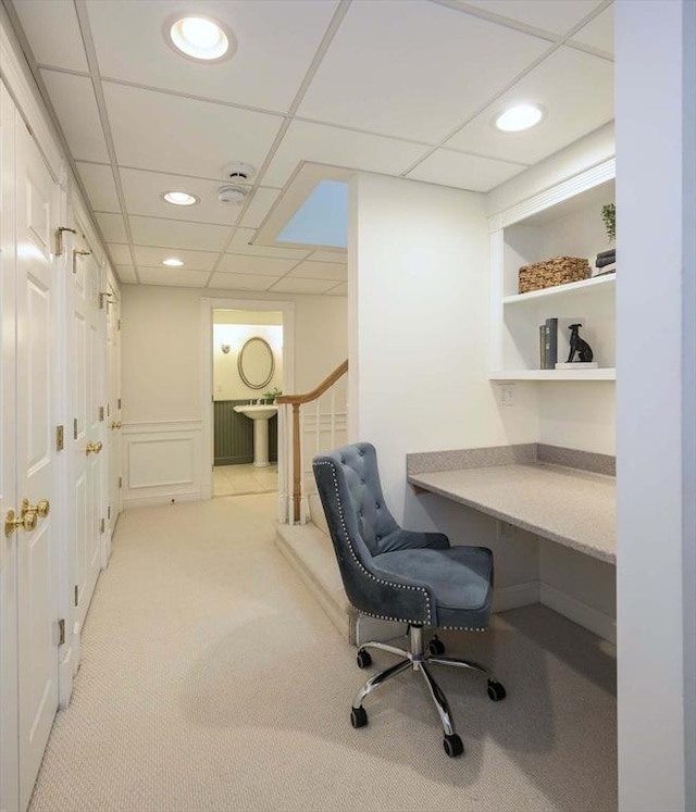 home office with a drop ceiling, recessed lighting, and light colored carpet