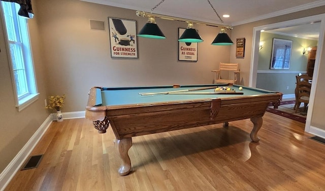 recreation room with wood finished floors, pool table, baseboards, visible vents, and crown molding