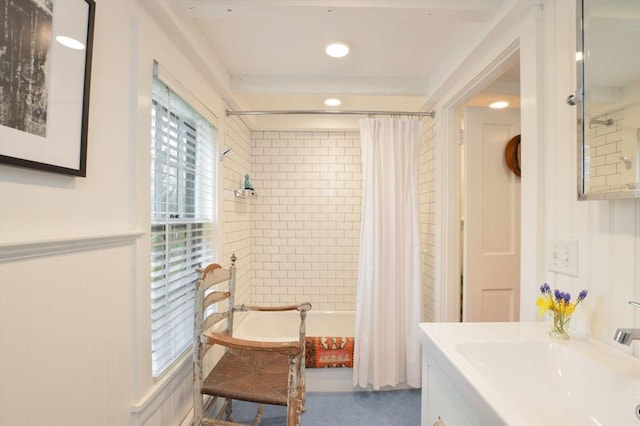 bathroom featuring vanity and shower / tub combo