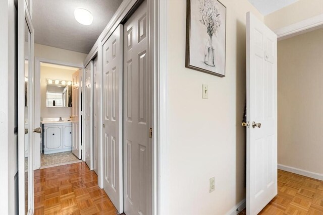 hallway featuring baseboards