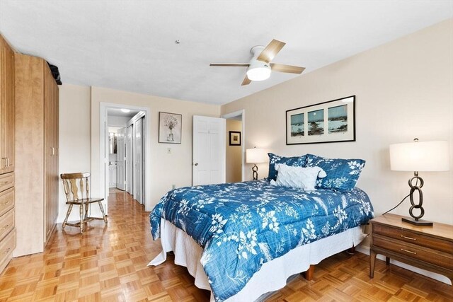 bedroom with baseboards and ceiling fan