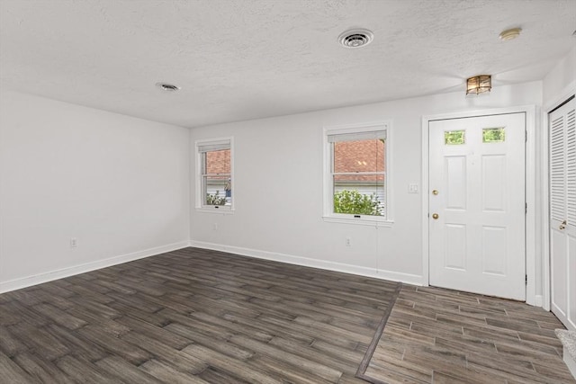 10 Enterprise St Unit 2, Duxbury, MA 02332 - entrance foyer with dark wood-style floors and a textured ceiling