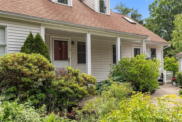 10 Enterprise St Unit 2, Duxbury, MA 02332 - property entrance featuring roof with shingles and covered porch