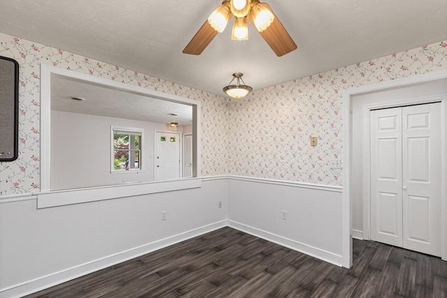 10 Enterprise St Unit 2, Duxbury, MA 02332 - spare room featuring wallpapered walls, wainscoting, dark wood finished floors, and a ceiling fan