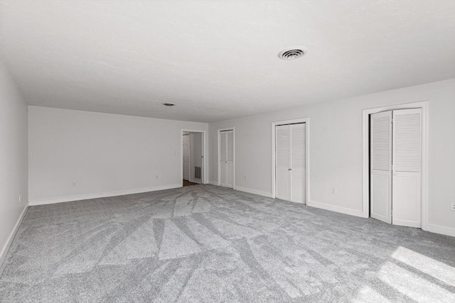 10 Enterprise St Unit 2, Duxbury, MA 02332 - unfurnished bedroom featuring two closets and carpet floors