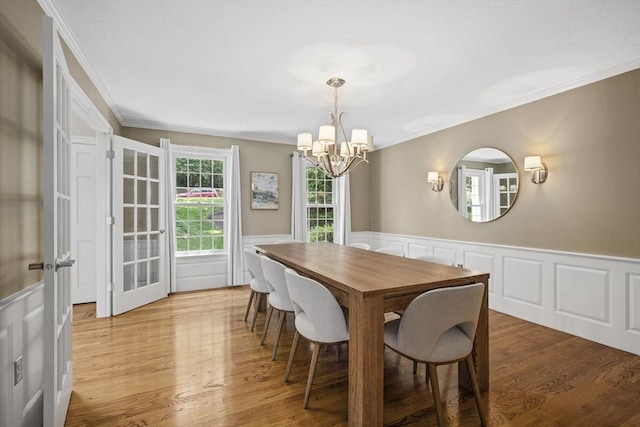 5 John Matthew Rd, Hopkinton, MA 01748 - dining room with a chandelier, wainscoting, ornamental molding, light wood-style floors, and a decorative wall