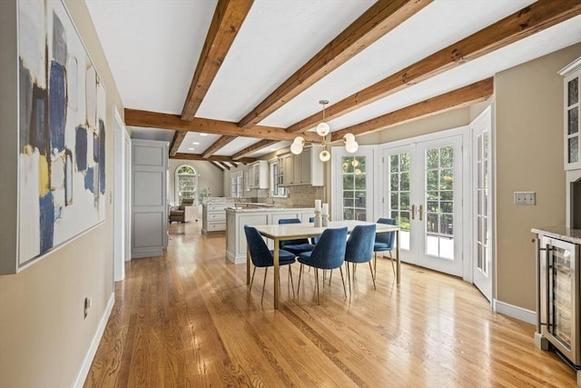 5 John Matthew Rd, Hopkinton, MA 01748 - dining area with wine cooler, french doors, light wood-style flooring, and beamed ceiling