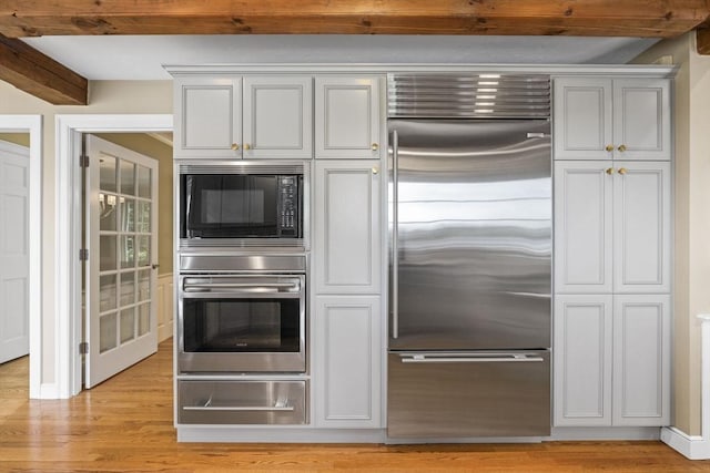 5 John Matthew Rd, Hopkinton, MA 01748 - kitchen with built in appliances, a warming drawer, light wood-style flooring, and beam ceiling