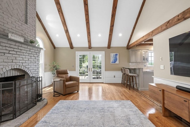 5 John Matthew Rd, Hopkinton, MA 01748 - living area with light wood-type flooring, french doors, a fireplace, recessed lighting, and wainscoting