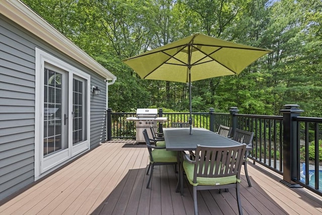 5 John Matthew Rd, Hopkinton, MA 01748 - wooden deck featuring outdoor dining space, view of scattered trees, and area for grilling