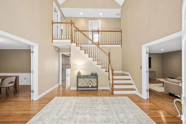 5 John Matthew Rd, Hopkinton, MA 01748 - staircase featuring a high ceiling, wood finished floors, and recessed lighting