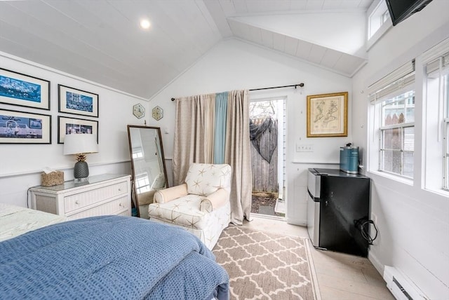 bedroom featuring vaulted ceiling, freestanding refrigerator, baseboard heating, and multiple windows