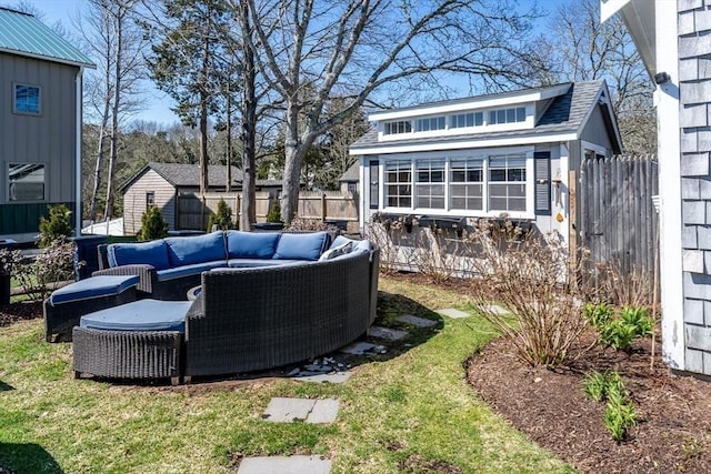 exterior space featuring a fenced backyard, an outdoor structure, and an outdoor living space
