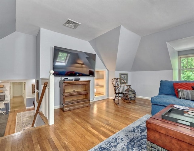 15 Blackburnian Rd, Lincoln, MA 01773 - living room with wood finished floors, lofted ceiling, and baseboards