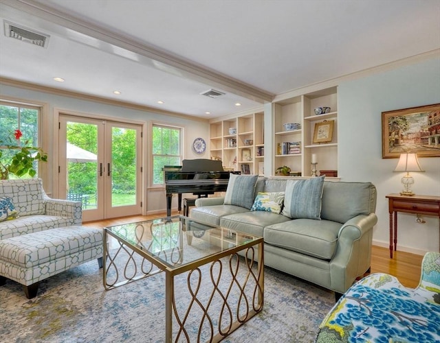 15 Blackburnian Rd, Lincoln, MA 01773 - living area featuring crown molding, wood finished floors, baseboards, french doors, and recessed lighting