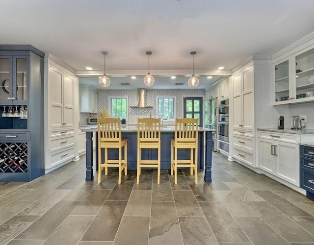 15 Blackburnian Rd, Lincoln, MA 01773 - kitchen with recessed lighting, wall chimney exhaust hood, white cabinetry, and glass insert cabinets