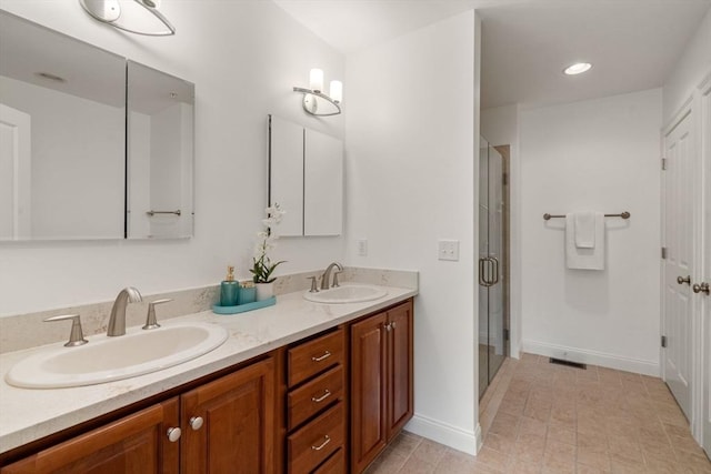 32 Old Framingham Rd Unit 20, Sudbury, MA 01776 - bathroom featuring double vanity, a shower stall, tile patterned floors, and recessed lighting