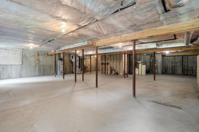 32 Old Framingham Rd Unit 20, Sudbury, MA 01776 - unfinished basement featuring gas water heater, heating unit, and a water softener system