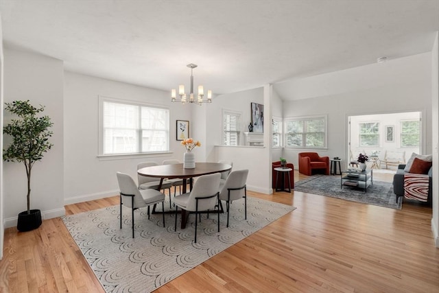 32 Old Framingham Rd Unit 20, Sudbury, MA 01776 - dining space featuring a chandelier, light wood-type flooring, and lofted ceiling