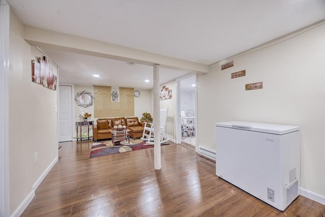 living area with recessed lighting, baseboards, and wood finished floors