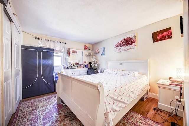 bedroom featuring wood finished floors