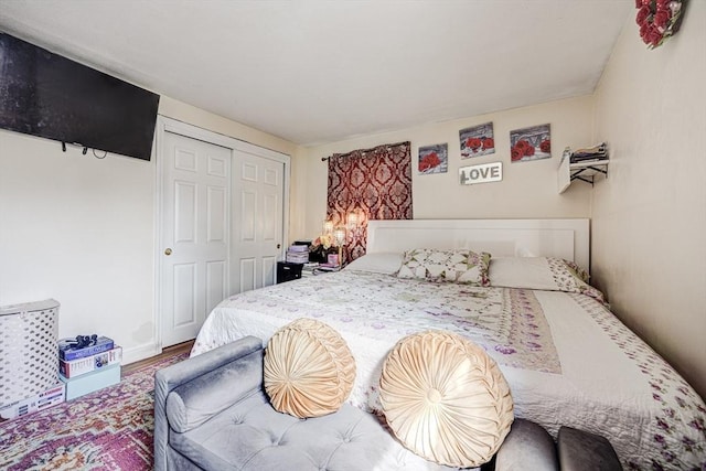 bedroom featuring a closet and wood finished floors