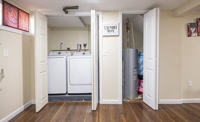 clothes washing area with separate washer and dryer, laundry area, wood finished floors, and water heater