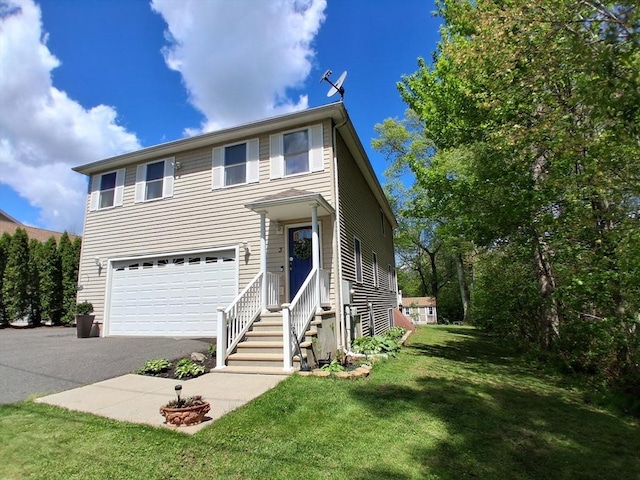 3 Birch Ave, East Longmeadow, MA 01028 - traditional home featuring a garage, driveway, and a front lawn