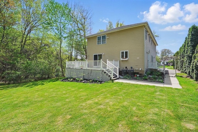 3 Birch Ave, East Longmeadow, MA 01028 - rear view of house featuring a lawn, a deck, and cooling unit