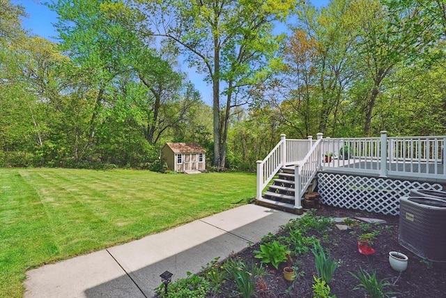 3 Birch Ave, East Longmeadow, MA 01028 - view of grassy yard featuring central air condition unit, an outdoor structure, and a deck