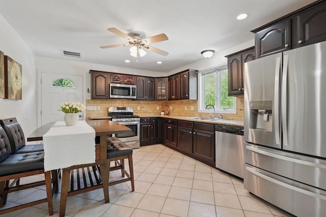 3 Birch Ave, East Longmeadow, MA 01028 - kitchen with appliances with stainless steel finishes, a sink, ceiling fan, tasteful backsplash, and dark brown cabinetry