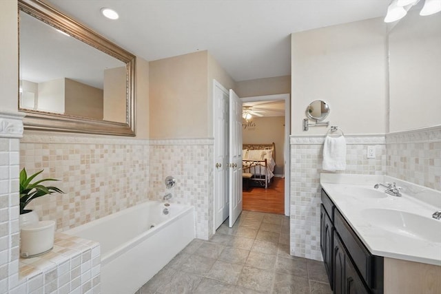 3 Birch Ave, East Longmeadow, MA 01028 - full bath featuring tile walls, ensuite bathroom, wainscoting, a garden tub, and ceiling fan