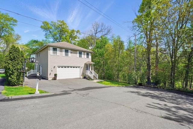 3 Birch Ave, East Longmeadow, MA 01028 - view of home's exterior with a garage and asphalt driveway