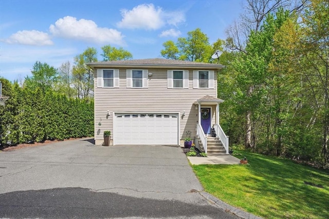3 Birch Ave, East Longmeadow, MA 01028 - traditional-style house with an attached garage, asphalt driveway, and a front lawn