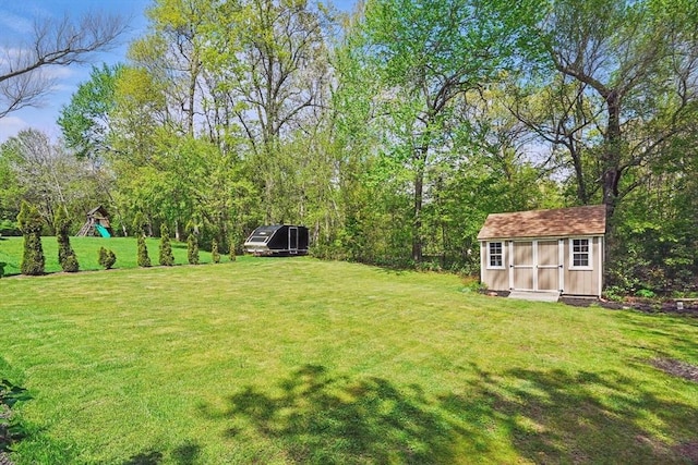 3 Birch Ave, East Longmeadow, MA 01028 - view of green lawn featuring a storage shed and an outdoor structure