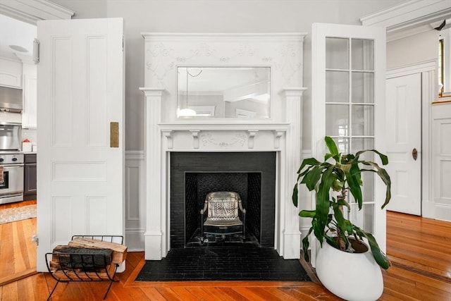 97 Manet Rd, Newton, MA 02467 - detailed view of a fireplace and wood finished floors